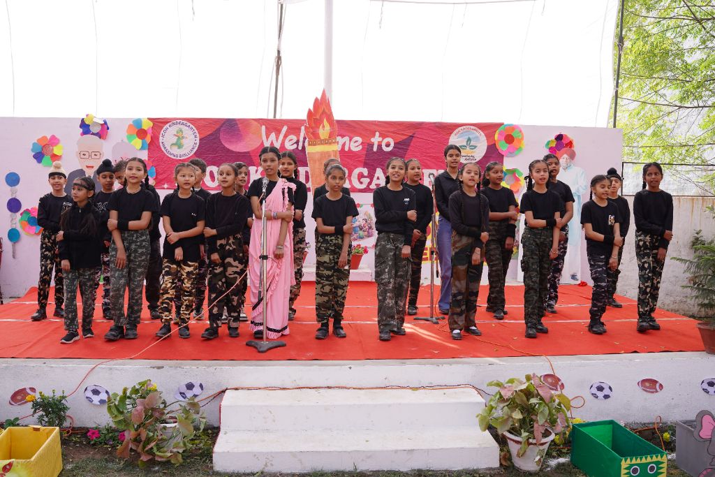 Annual Function — students in army/military dress with teacher