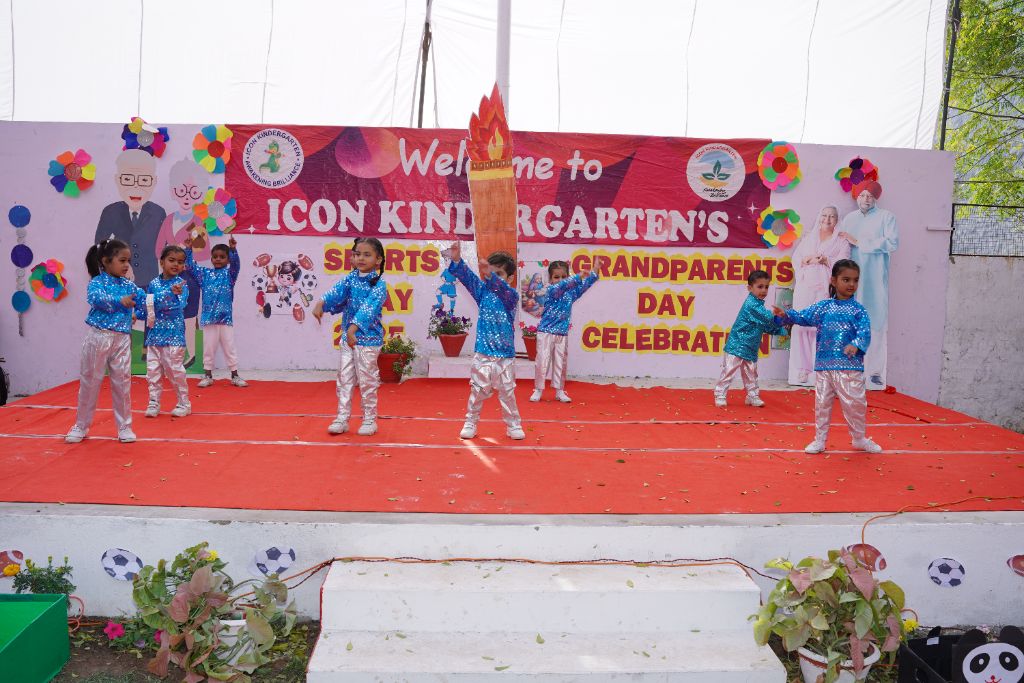 Sports & Grandparents Day — kids in blue sequin costumes dancing