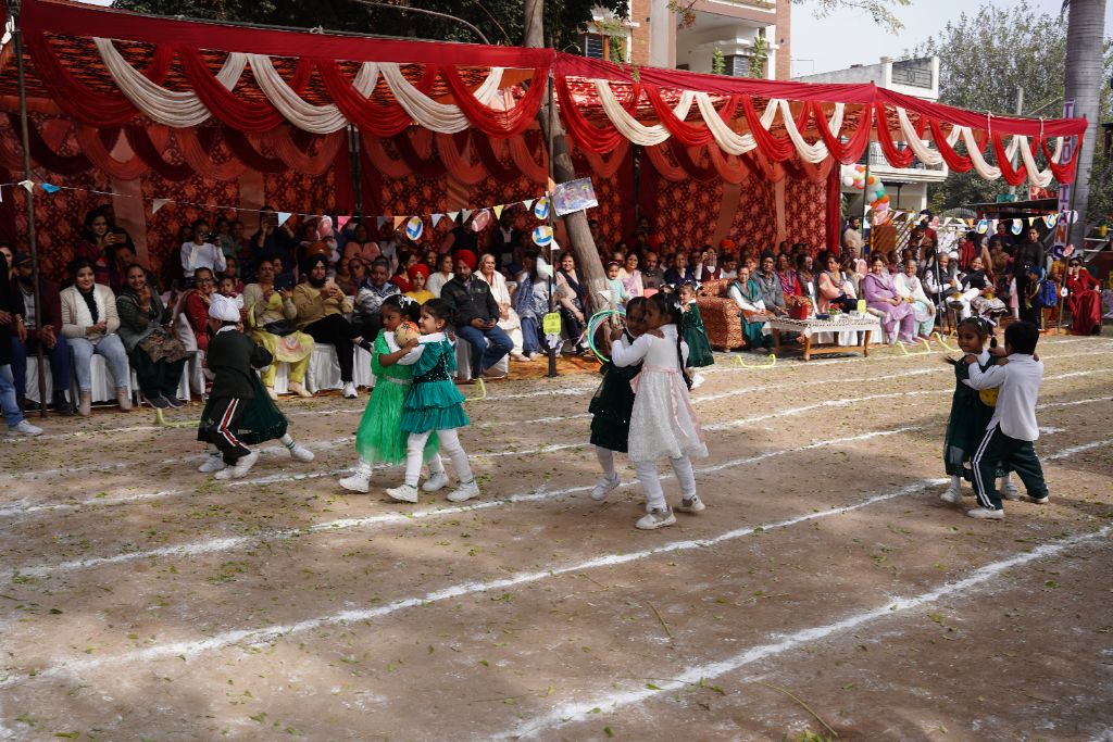 Sports Day — Girls Running Race with large crowd