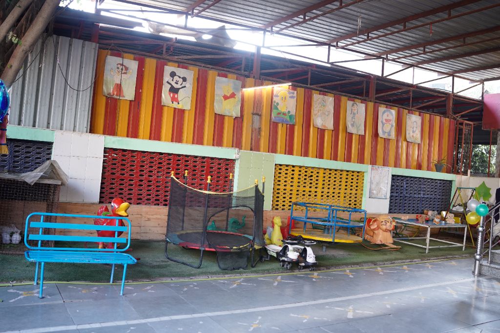 Icon Kindergarten play area with cartoon artwork and rides