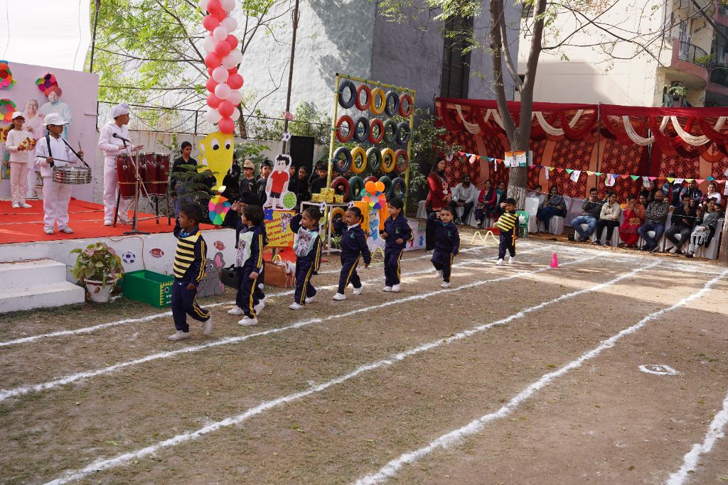 Sports Day — young kids in bee costume marching